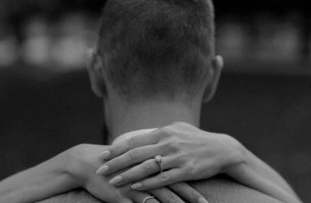 Wedding ring on manshoulder