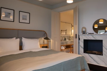 CORI hotel Superior Ocean View fireplace by bed